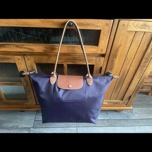 Longchamps Large Plum colored Le Pilage travel bag